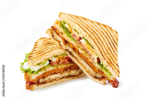 Two halves of club sandwich on white