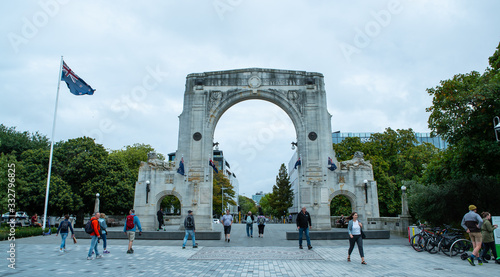 People walking past Bridge of Remembrance in Christchurch New Zealand