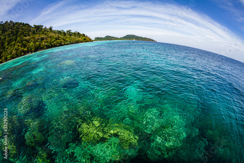 Crystal clear transparent waters in paradisiacal Ko Rok island in the andaman coast, Thailand. Fish eye lens