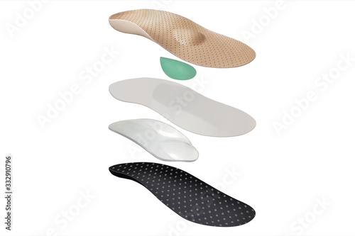 Isolated orthopedic insole on a white background. Treatment and prevention of flat feet and foot diseases. Foot care, comfort for the feet. Wear comfortable shoes. Medical insoles.