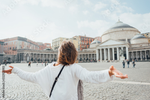 Young woman tourist in the front of Piazza del Plebiscito