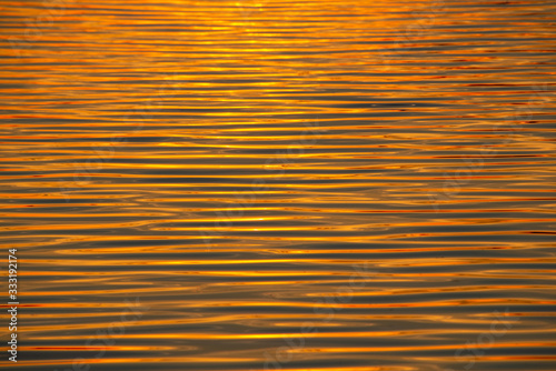 Beautiful golden water at sunset texture