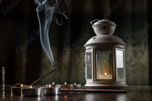  Burning incense and candles to create a mood. Religion, aroma, incense sticks, relaxation, meditation, home, decor