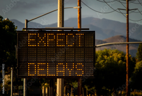 Electrionic traffic sign stating Expect Delays withtraffic