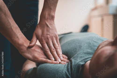 Physiotherapist treating patient for various physical ailments