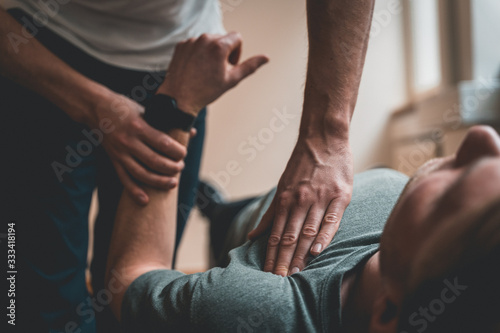 Physiotherapist treating patient for various physical ailments