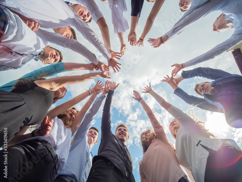 Friendly friends spread their hands. The concept of strong friendship.