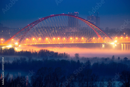 Illumination of Bugrinskiy bridge in winter, Novosibirsk, Siberia