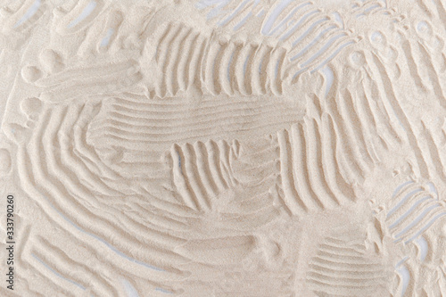 background drawing on natural sand in the sandbox