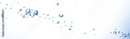 The bubbles float in clear water. Expressing freshness White background