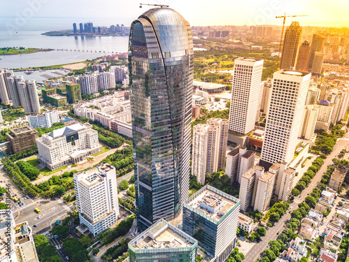 Haikou, Hainan, China - Aug 4th 2018: Haikou Cityscape with Tallest Landmark Buildings in the Binhai Main Road, Marina Bay CBD Area, The Capital City of Hainan Free Trade Zone, China. Aerial View.