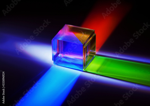 a crystal cube reflects colored rays