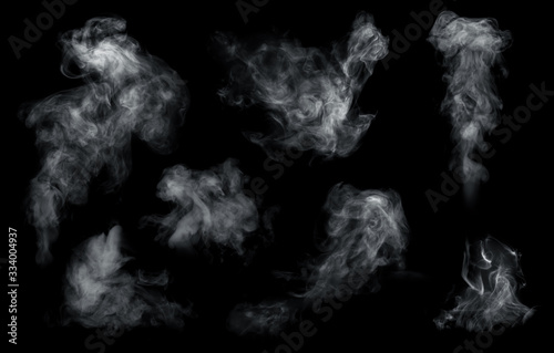 Fog or smoke set isolated on black background. White cloudiness, mist or smog background.