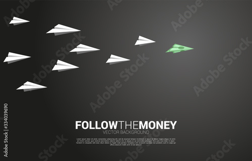 money banknote origami paper airplane lead white airplane. Business Concept of investor and venture capital.