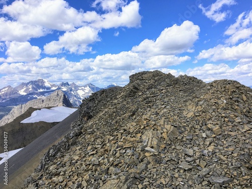 High in the rocky mountains doing the Northover Ridge hike in Kananaskis, Alberta, Canada. This portion of the ridge is scree or small, loose rocks covering the slope of the ridge.