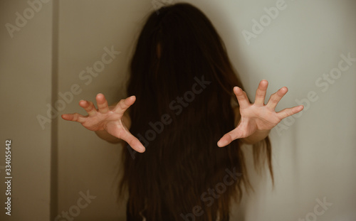 Portrait of unknown horror woman having Psychosis or Depression disease attacking her mind. Conceptual shot of unhealthy woman moods when Depression occur.