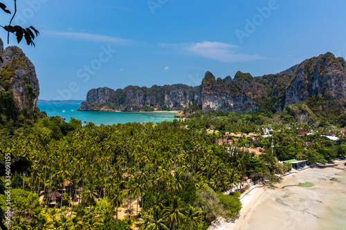 A beautiful tropical view of beaches, lush foliage and towering cliffs (Railay Beach, Thailand)