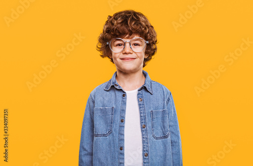 Happy smart boy in glasses