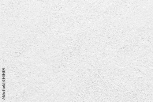 White concrete wall grunge background, cement construction material texture backdrop.
