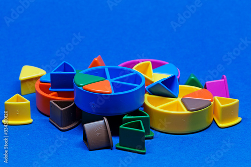 Umea, Norrland Sweden - March 25, 2020: a pile of game pieces in different colors