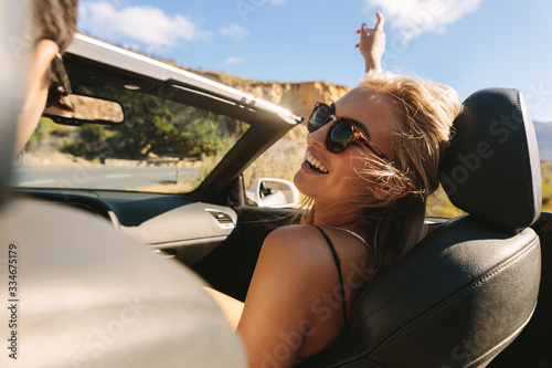 Woman enjoying on a roadtrip with her boyfriend