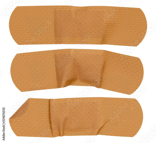 Used sticking plasters isolated on white background. Medical plasters.