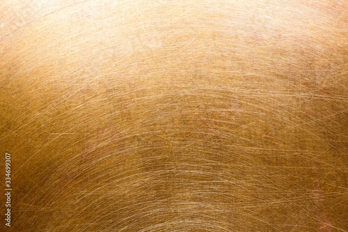 radial scratched brass surface background. high-detailed metal texture