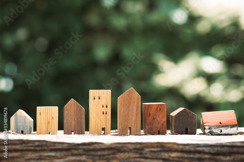 House model on wood table. Real estate agent offer house, property insurance and security, affordable housing concepts