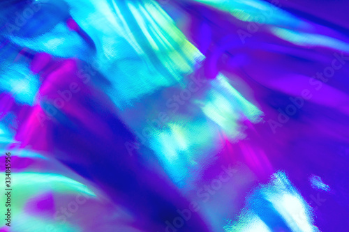 Blurred texture in violet, pink and mint colors. Abstract trendy holographic background in 80s style. Synthwave. Vaporwave style. Retrowave, retro futurism, webpunk