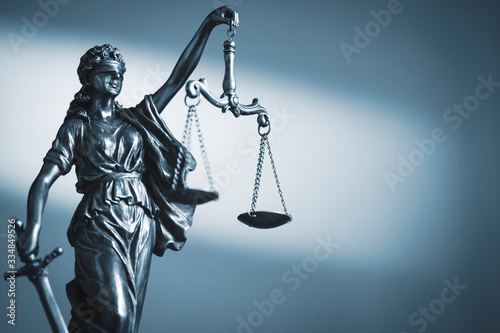 Figure of Justice holding scales and a sword