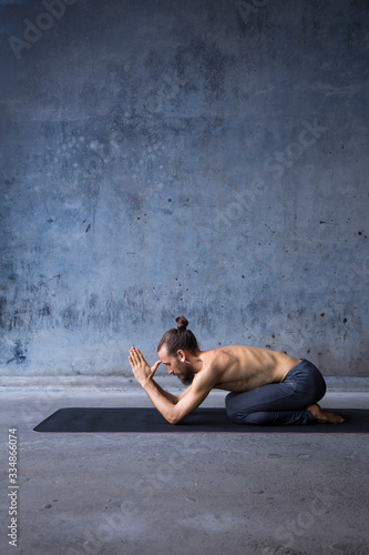 Man practicing yoga and meditation
