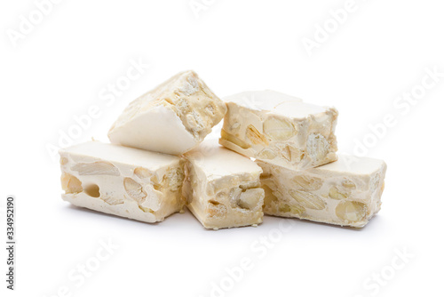 small nougat pieces on white background.