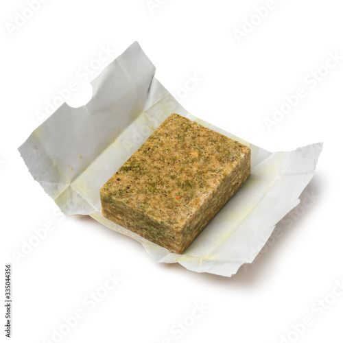 Single vegetarian Bouillon cube on paper