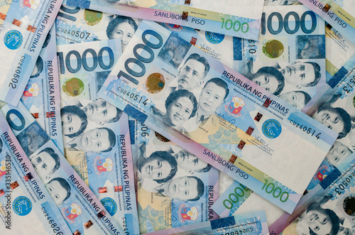 Flat lay view of 1000 Philippine peso cash