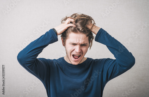 man yelling and took his head