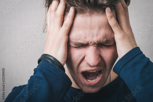 man yelling and took his head