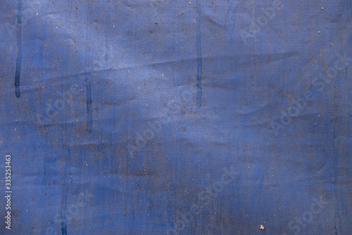 abstract background of old dirty blue tarpaulin close up