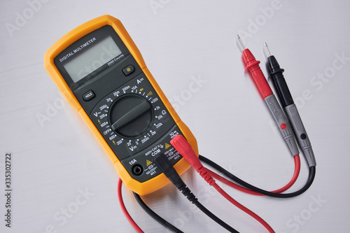 Digital multimeter with probes.