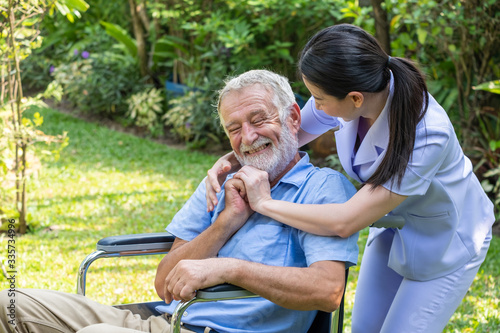 Young nurse take care senior man at home, Senior man happniess and smiling with nurse, Health care concept