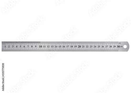A metal ruler with a scale of up to 30 centimeters is isolated on a white background. 