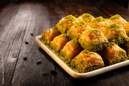 Turkish traditional dessert baklava with pistachio and walnut close up