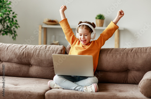 Girl celebrating victory in video game.