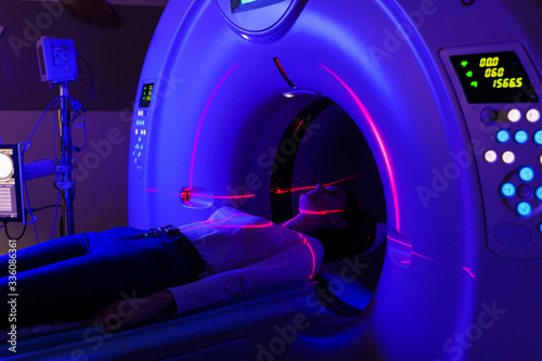 CT of joints in a clinic with blue color and red scanning laser. computer diagnostics of injuries, inflammatory and dystrophic joint diseases for a girl