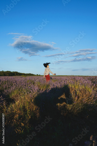 jumping woman in lavender field