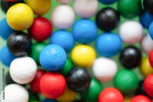 Multi-colored round balls are all together in a group in one pile: background, anti-stress, abstraction
