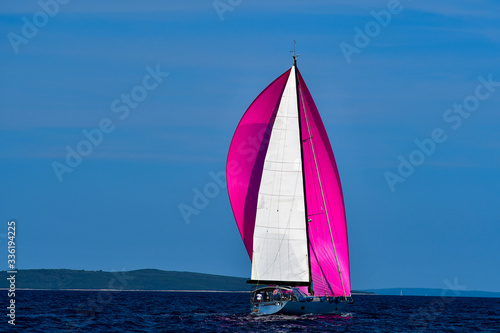 Crimson spinnaker boat