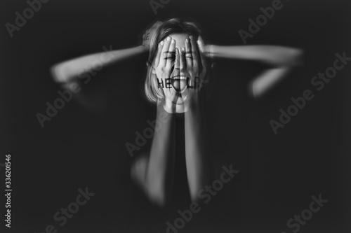 Woman having panic attack on dark background