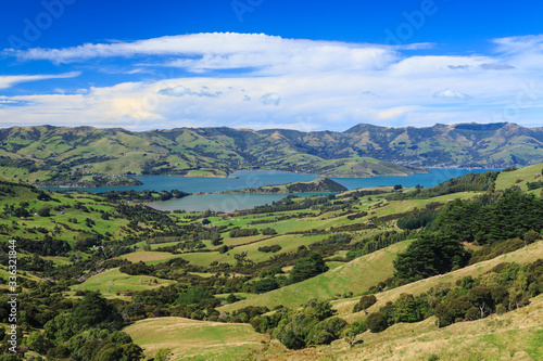 Banks Peninsula, New Zealand. A panoramic view of Akaroa Harbour (the town of Akaroa is to the right) from the surrounding hills
