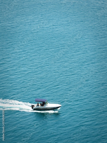 Speeding motorboat on azure water