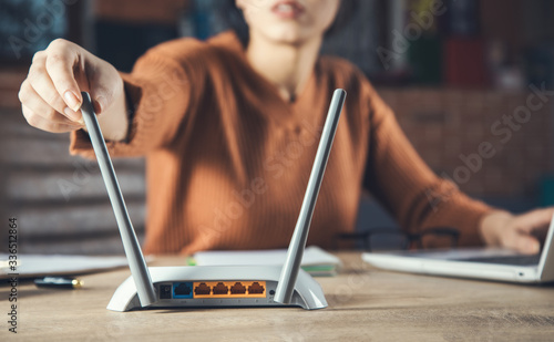 woman hand wireless router